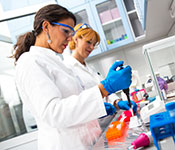 Photo by PointImages/iStock/Thinkstock. Two female scientists researching in laboratory.