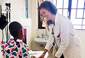 Dr. Dorothy Dow examines a young patient in an exam room