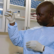 Simani Gaseitsiwe working in a lab.