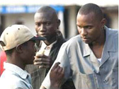 Three African men talking