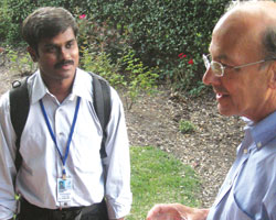 PHOTO: Scholar speaks with Dr. Roger I. Glass