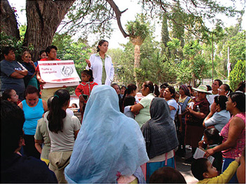 Dr. Veronica Romero stands up in front of a crowd of mostly women.