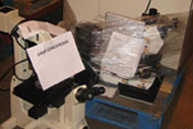 Large piles of scientific equipment wrapped partially in clear plastic wrapping