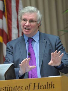 Lord Nigel Crisp speaks at a podium