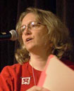 Close up of Dr. Janis Weeks speaking into microphone