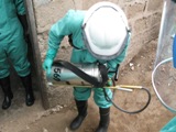 photo of a man with a DDT spray canister