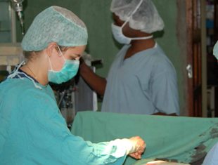 Scholar Krista Pfaendler performing cervical cancer surgery in Zambia.