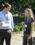 Scott Peterson talking to Vanderbilt University program coordinator Tiffany Patterson at Stone House the barbecue.