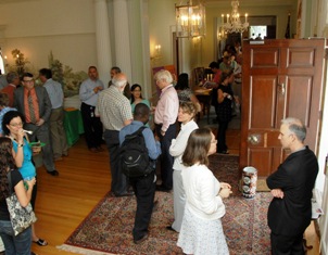 Staff mingle in the Stone House foyer during Fogarty's 40th anniversary open house