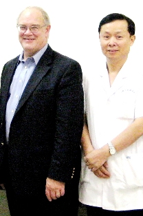 NEI Director Dr. Paul A. Sieving standing next to Dr. Chen Song of Tianjin Eye Hospital for photo.