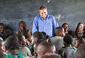 Peter Singer stands in front of crowded classroom