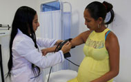 © PAHO-WHO/David Spitz, A pregnant woman in Colombia receives care during the 2016 Zika outbreak