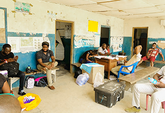 Dr. Robert Samuels meets with patients as part of his study on pre-existing immunity in Ebola and Lassa Fever Survivors in Kono, Sierra Leone
