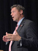 Dr. Seth Berkley speaks at a podium