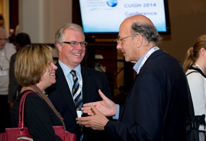 Fogarty director Dr Roger Glass mingles and speaks with grantees in a conference room at the CUGH conference