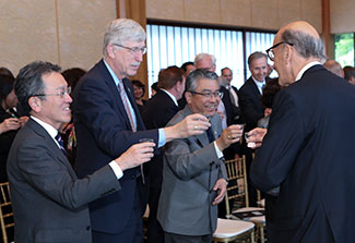NIH and Japanese leadership raise a glass to make a toast during the HFSP 30th anniversary reception.