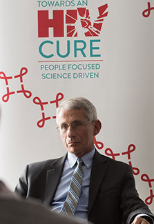 NIAID Director Dr. Anthony Fauci seated during press conference at IAS conference