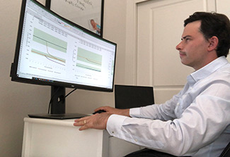 Dr Cepeda works with data on his computer screen