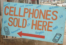 Roughly made sign reads 'Cellphones sold here'