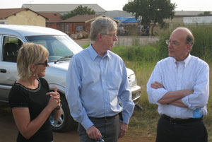 Dr. Glenda Gray, NIH Director Dr. Francis S Collins, and Fogarty Director Dr. Roger I Glass stand speak to each other